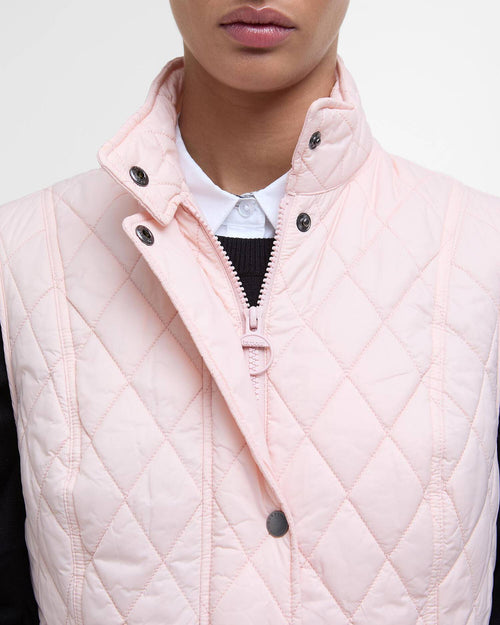 Barbour women's pink quilted gilet close-up of zip placket and snap buttons