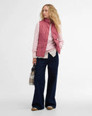 Quilted sleeveless gilet in Wildberry pink with stand collar and flap pockets