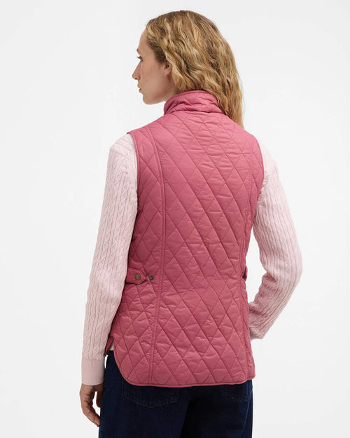 Back view of Wildberry pink quilted gilet with diamond quilting and high collar