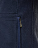 Navy fleece waistcoat close-up of full-zip track and logo tag on front panel