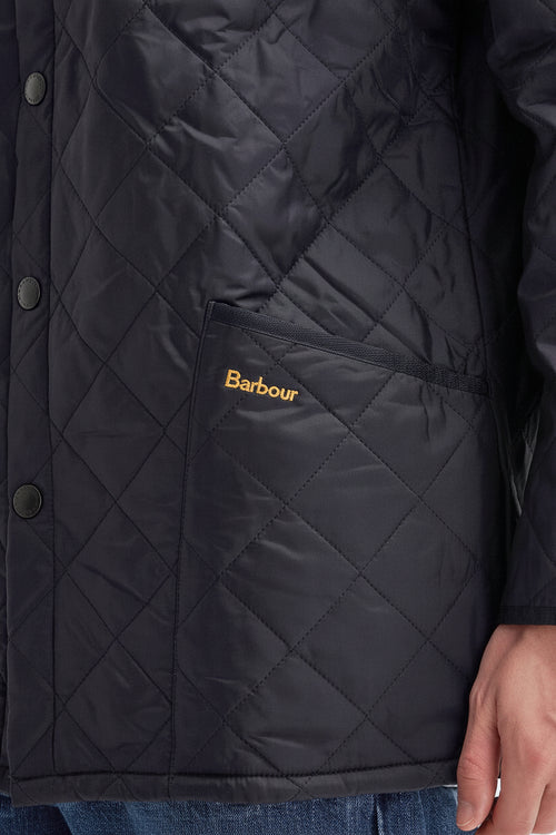 Barbour Liddesdale jacket quilted dark navy chest detail with Barbour logo patch.