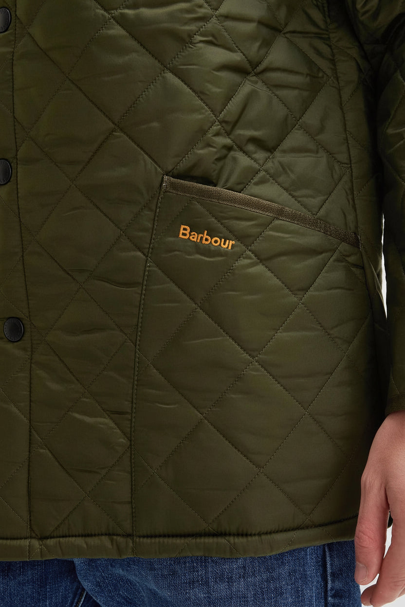 Men's olive quilted jacket interior with Barbour logo patch