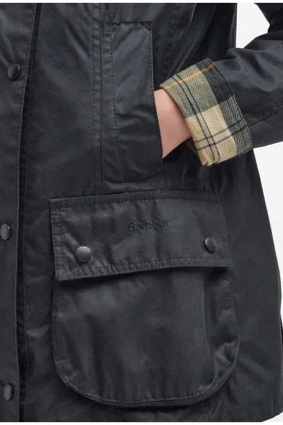 Barbour ladies wax Beadnell jacket with plaid cuff and large flap pocket, dark