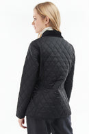Black quilted women’s jacket with stand collar, button front, back-left view