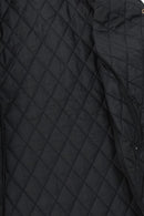 Black quilted jacket with diamond stitch pattern, close-up on outer panel