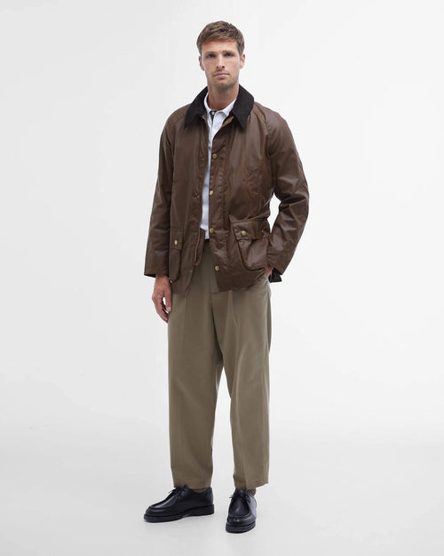 Barbour Ashby Wax Jacket - Bark wax jacket worn with light shirt and tan trousers, button closures