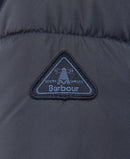 Barbour logo patch on dark navy quilted jacket, triangle badge detail