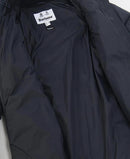 Dark navy quilted jacket chest area with Barbour label and zip-front