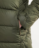 Quilt jacket sleeve with partial view of side seam zipper and snap closure