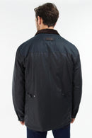 Men's navy wax jacket back view with yoke panel and snap button collar