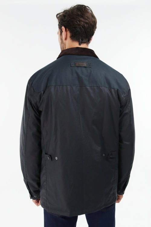 Men's navy wax jacket back view with yoke panel and snap button collar