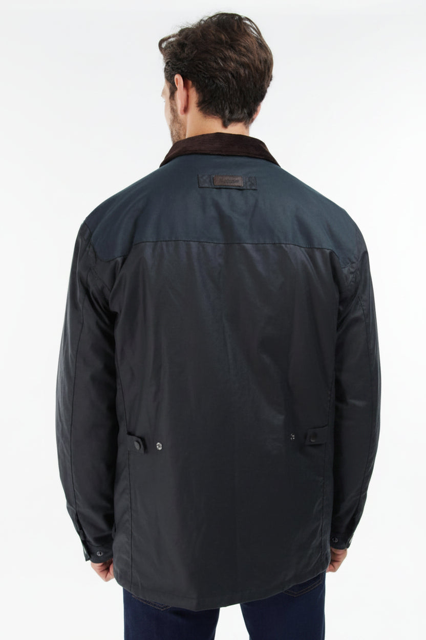 Men's navy wax jacket back view with yoke panel and snap button collar