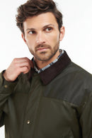 Barbour wax jacket collar and front placket in olive green, snap buttons and pockets