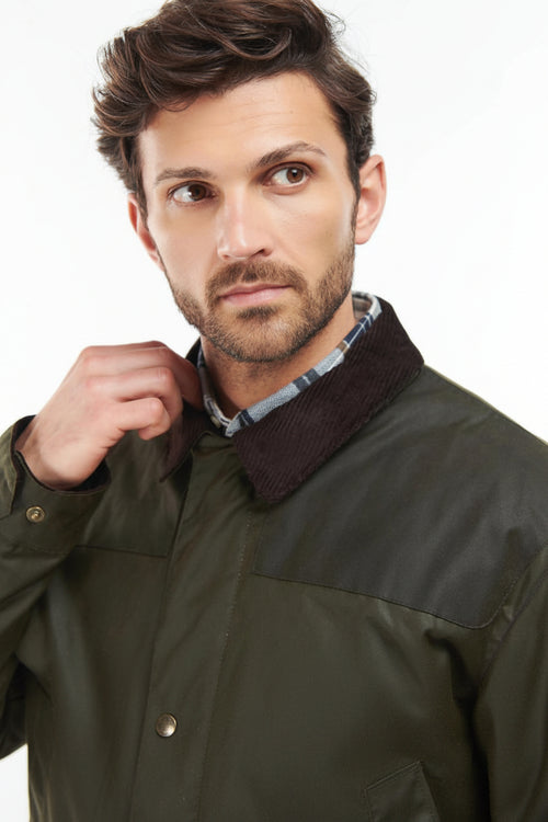 Barbour wax jacket collar and front placket in olive green, snap buttons and pockets