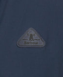 Barbour logo patch on navy waterproof jacket, triangular embroidered badge