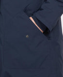Navy waterproof jacket chest pocket with metal snap button and flap