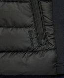 Black quilted jacket pocket with zip and Barbour embroidery detail