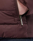 Barbour quilted jacket close-up with front zipper pull and diamond quilting