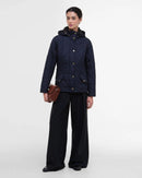 Women's navy quilted hooded jacket with full front zip and gold button details