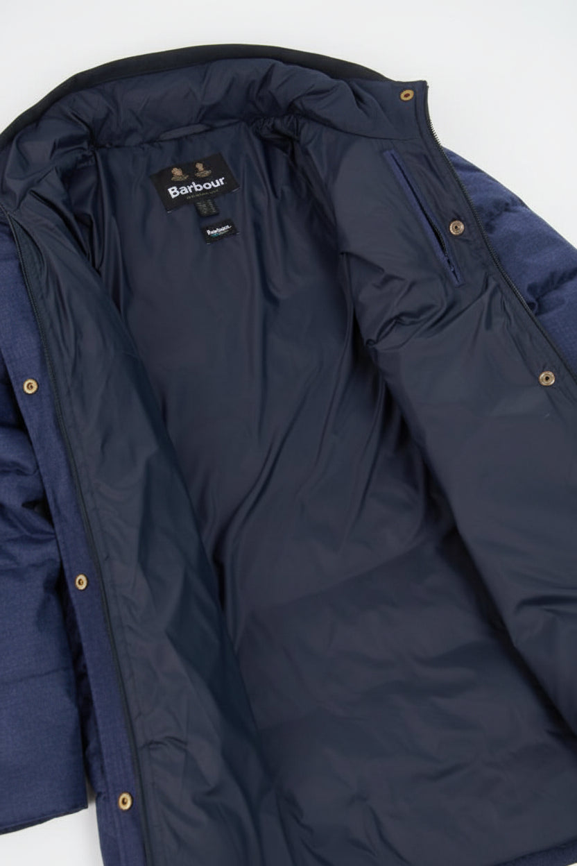 Quilted hooded jacket in dark navy with snap buttons and stitched panels
