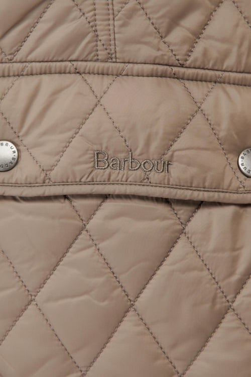 Quilted Barbour gilet in light tan with diamond stitching and front logo badge