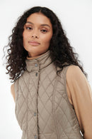 Quilted vest gilet with stand collar, button front, and diamond quilting in light tan