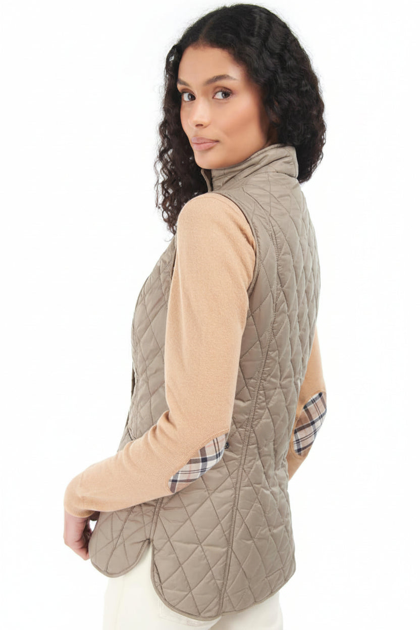 Quilted light tan vest gilet with stand collar and diagonal snap pockets