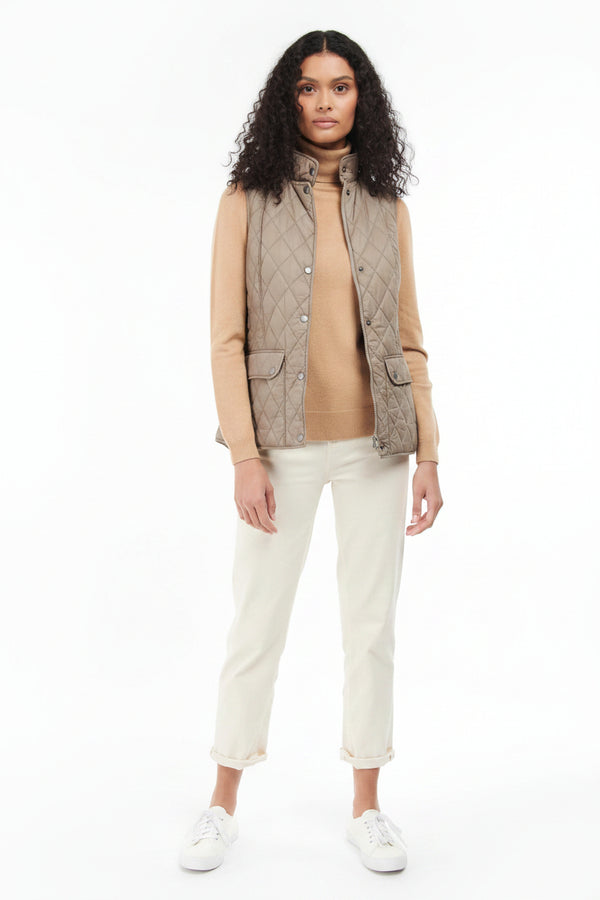 Quilted vest gilet in light tan with front buttons and stand collar