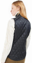 Black quilted gilet vest shown from back with diamond stitching and zip center seam
