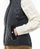 Black quilted gilet vest with diamond stitching, zip front, and side pockets
