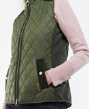 Olive quilted gilet with full zip, black side panels, stand collar, and flap pockets