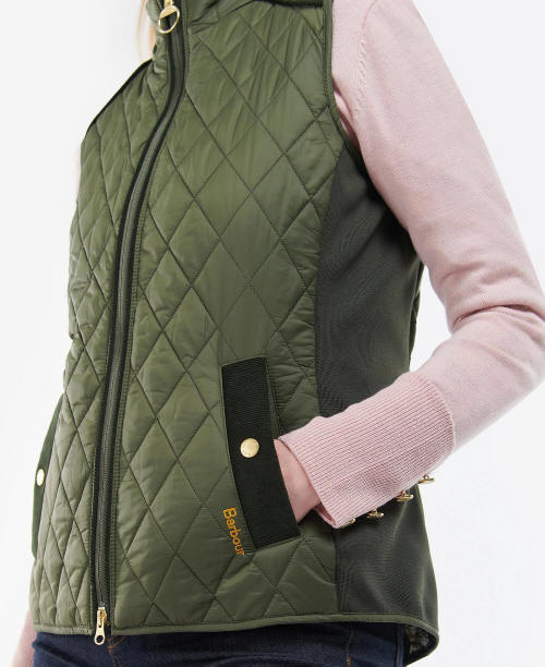 Olive quilted gilet with full zip, black side panels, stand collar, and flap pockets
