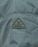 Dark green quilted coat with triangular Barbour logo patch