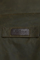 Barbour logo patch on olive jacket yoke with stitched edges
