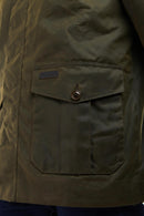 Olive Barbour jacket chest pocket with flap and metal button