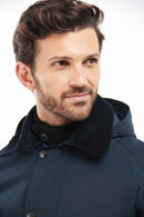 Barbour navy hooded jacket with buttoned front and dark knit collar