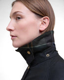 Black women’s wax jacket neck detail with plaid lining and gold-tone button closure