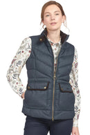 Women’s navy quilted gilet vest with stand collar, full zipper, and two front flap pockets.