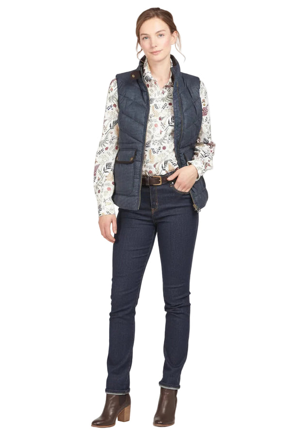 Navy quilted sleeveless gilet with full zip, stand collar, and front utility pockets.