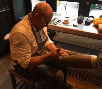 Tall brown boots with side buckles, shown during in-store fitting