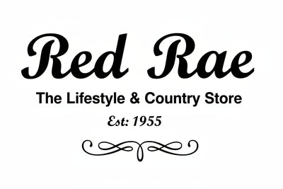 A close-up of a printed sign or logo reading 'Red Rae' in large black script, with 'The Lifestyle & Country Store' and 'Est. 1955' below on a light background.